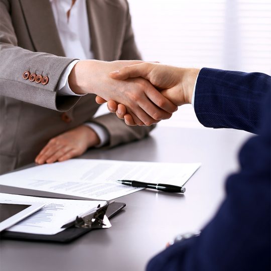 Photo of Satisfied Client Shaking Hands